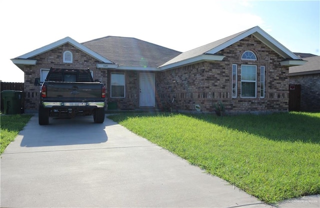 ranch-style home featuring a front yard