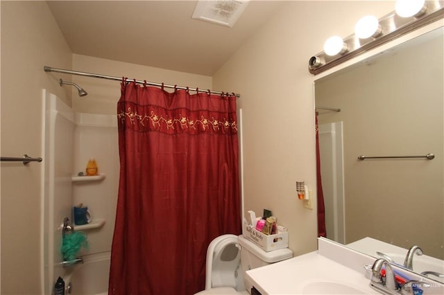 full bathroom with vanity, toilet, and shower / bath combo with shower curtain