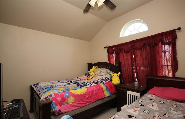 tiled bedroom featuring ceiling fan and vaulted ceiling