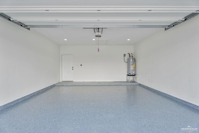 garage featuring a garage door opener and electric water heater