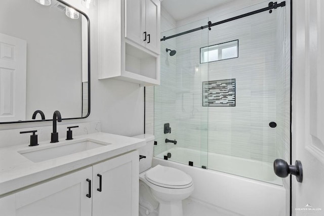 full bathroom with toilet, vanity, and shower / bath combination with glass door