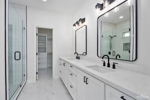 bathroom featuring vanity and an enclosed shower