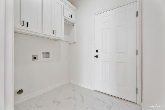 clothes washing area with cabinets, hookup for a washing machine, and electric dryer hookup