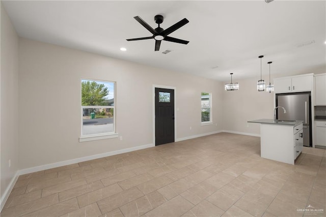 505 E Hawk Ave E, Pharr, TX 78577 - unfurnished living room featuring ceiling fan and recessed lighting