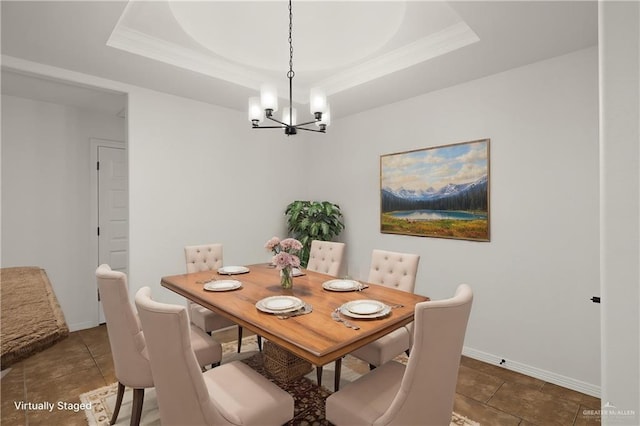 dining room featuring an inviting chandelier, tile patterned floors, and a raised ceiling