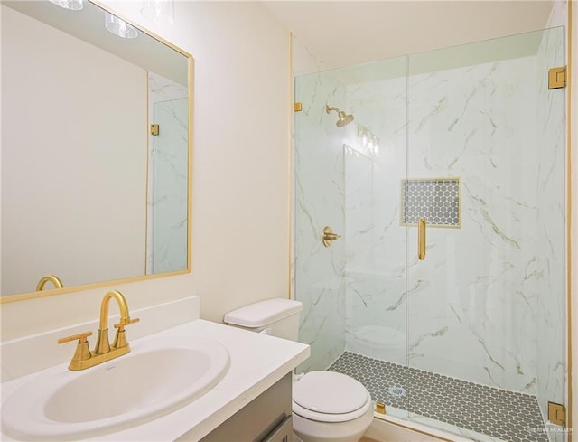 bathroom with an enclosed shower, vanity, and toilet