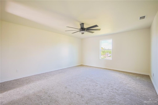 unfurnished room featuring carpet and ceiling fan