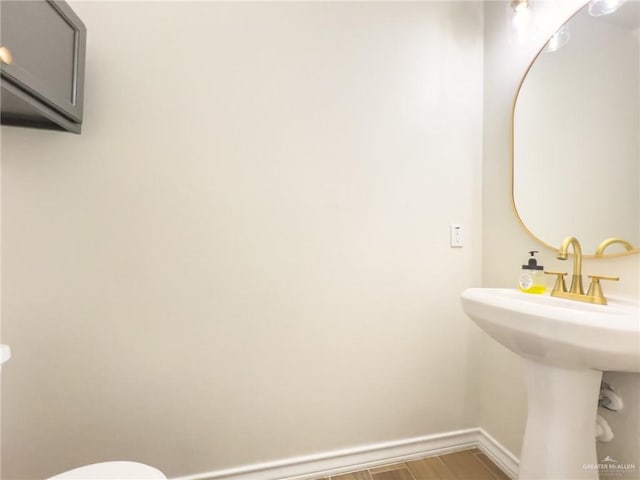 bathroom with hardwood / wood-style flooring