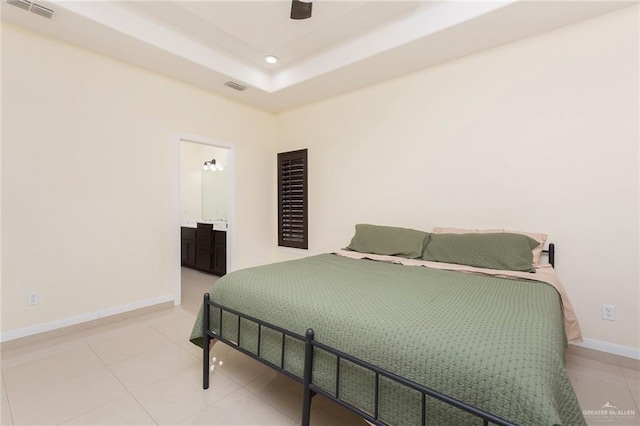 tiled bedroom featuring baseboards, visible vents, a raised ceiling, and recessed lighting