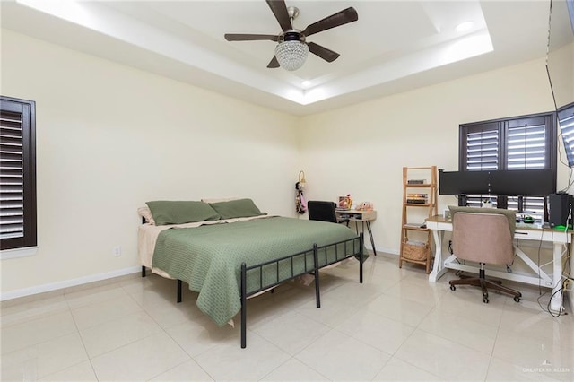 bedroom with recessed lighting, a raised ceiling, a ceiling fan, light tile patterned flooring, and baseboards