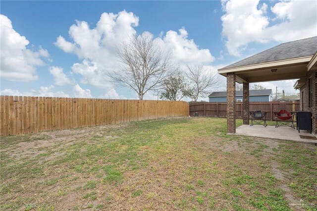 view of yard with a patio and a fenced backyard