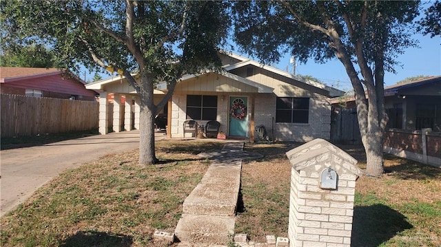 view of front of home with a carport