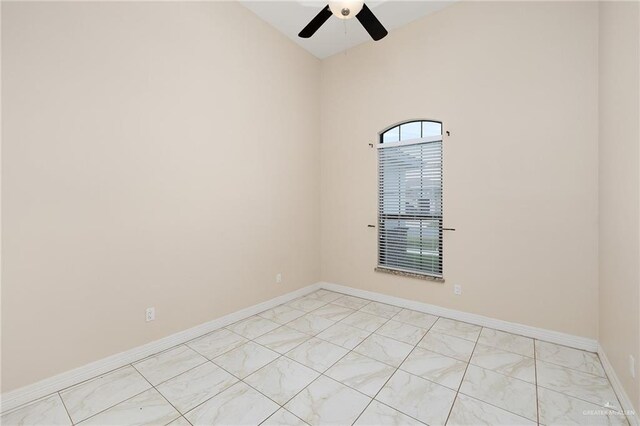 8605 Estrella Dr, Elsa, TX 78538 - spare room with ceiling fan, baseboards, and marble finish floor