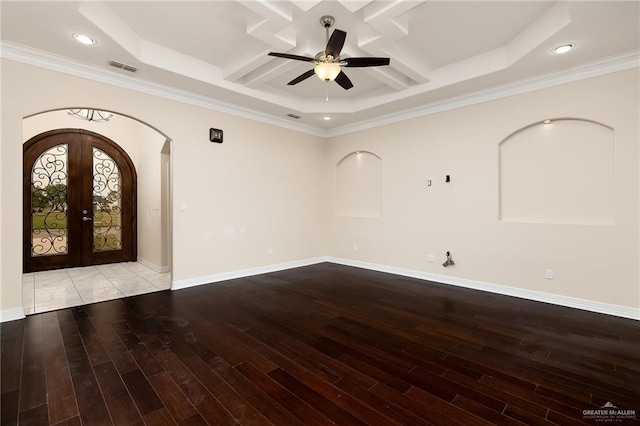 8605 Estrella Dr, Elsa, TX 78538 - interior space featuring arched walkways, ceiling fan, coffered ceiling, and wood finished floors