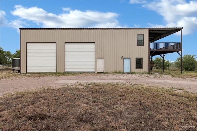 garage with a garage and driveway