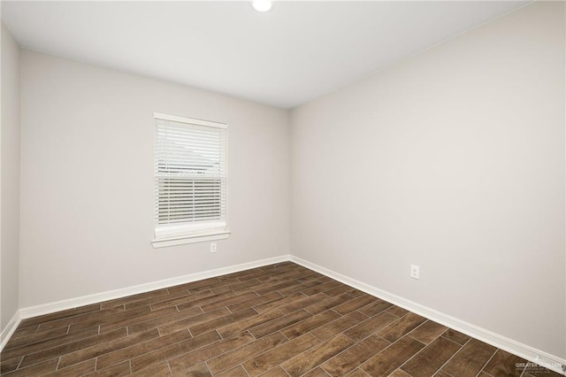 spare room featuring dark hardwood / wood-style floors