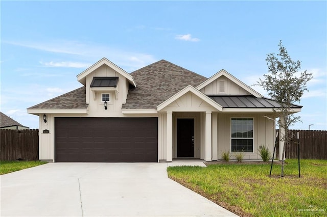 view of front facade with a garage and a front yard