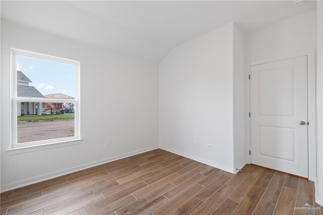 3213 El Paso Dr, Weslaco, TX 78599 - additional living space featuring wood finished floors, lofted ceiling, and baseboards