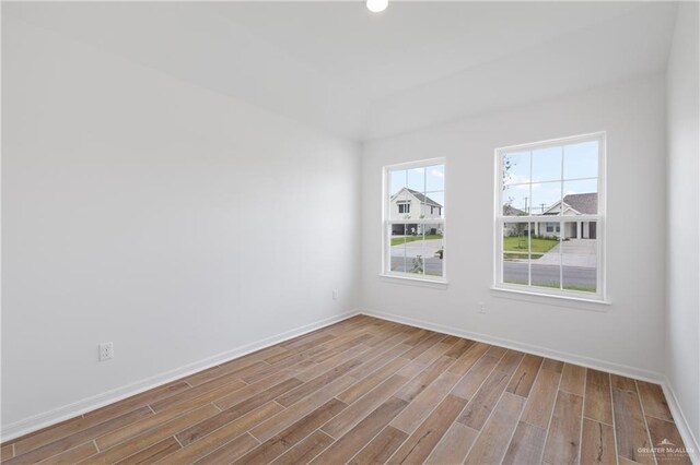 3213 El Paso Dr, Weslaco, TX 78599 - empty room featuring wood finished floors, baseboards, and recessed lighting
