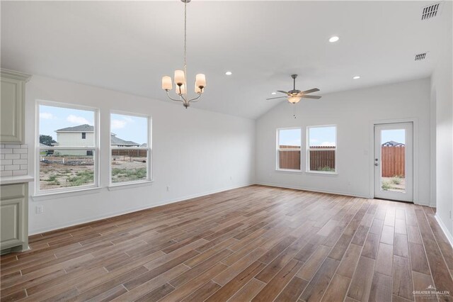 3213 El Paso Dr, Weslaco, TX 78599 - unfurnished living room featuring a ceiling fan, wood finished floors, a chandelier, recessed lighting, and baseboards