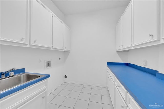 412 Sabine Ct, Mission, TX 78572 - laundry room with cabinet space, washer hookup, and light tile patterned floors