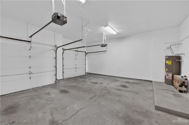 412 Sabine Ct, Mission, TX 78572 - garage featuring water heater and a garage door opener