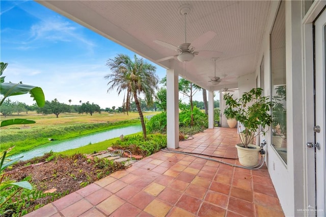 412 Sabine Ct, Mission, TX 78572 - view of patio featuring ceiling fan and a water view