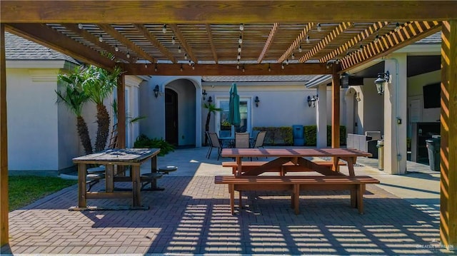 view of patio with a pergola and outdoor dining area