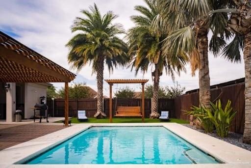 view of swimming pool featuring a patio area, a fenced in pool, a pergola, and a fenced backyard