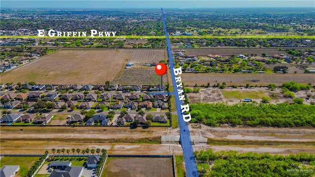 birds eye view of property with a residential view