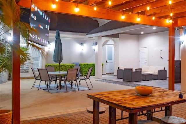 dining room with beam ceiling, brick floor, and arched walkways