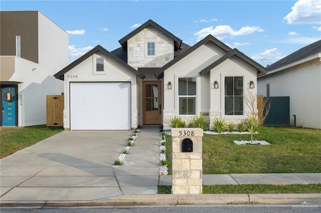 view of front of property with a front yard and a garage