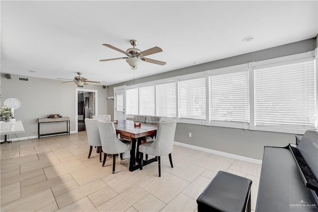 dining room featuring ceiling fan and light tile patterned floors