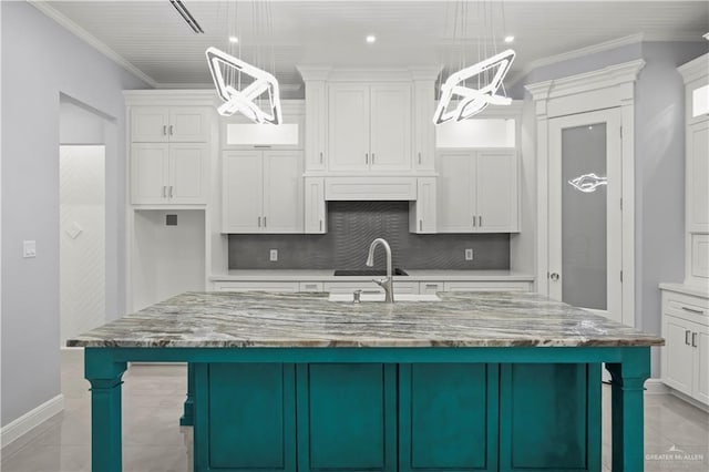 3313 Showboat Dr, Edinburg, TX 78541 - kitchen with white cabinets, a chandelier, ornamental molding, and recessed lighting