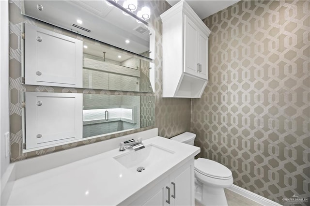 3313 Showboat Dr, Edinburg, TX 78541 - bathroom with vanity, toilet, a shower stall, and wallpapered walls