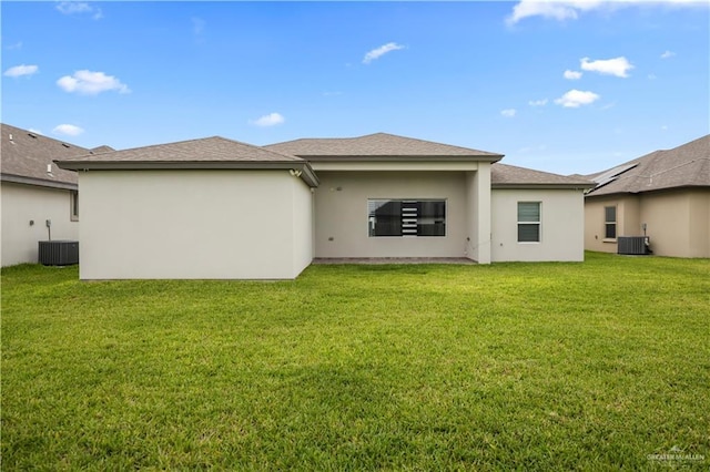 3313 Showboat Dr, Edinburg, TX 78541 - rear view of property with a lawn, cooling unit, and stucco siding