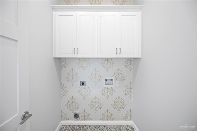 3313 Showboat Dr, Edinburg, TX 78541 - laundry room featuring electric dryer hookup, hookup for a washing machine, baseboards, and cabinet space