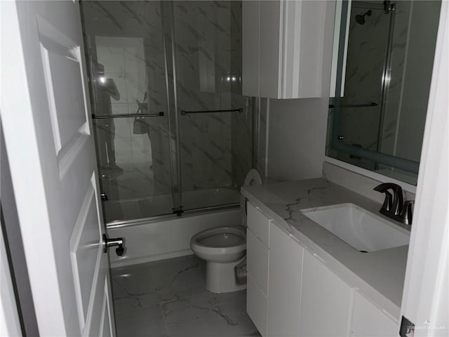 full bathroom featuring enclosed tub / shower combo, vanity, and toilet