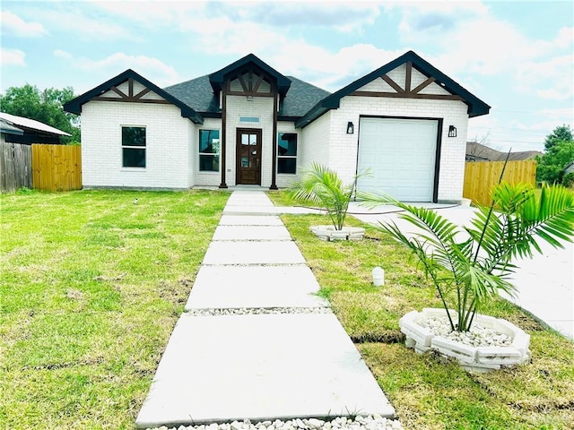 412 S Bowie Ave, Elsa, TX 78538 - view of front facade featuring brick siding and an attached garage