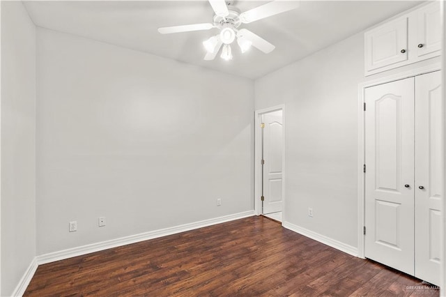 unfurnished bedroom featuring a closet, ceiling fan, and dark hardwood / wood-style flooring