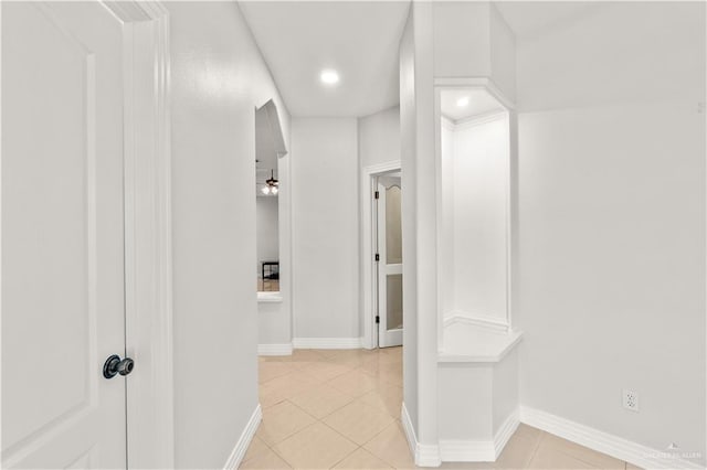 corridor with light tile patterned flooring