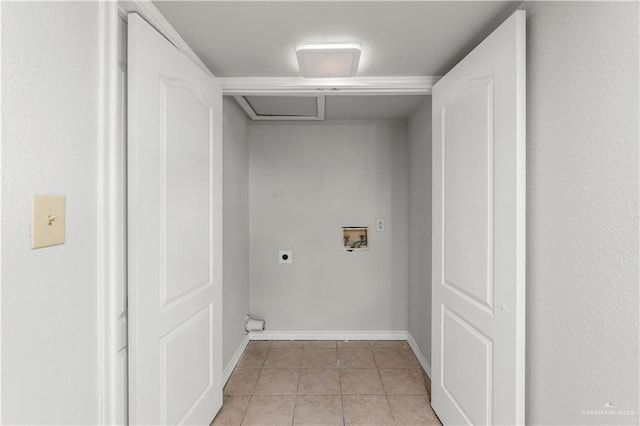 2904 N 26th St, Mcallen, TX 78501 - laundry room featuring electric dryer hookup, hookup for a washing machine, light tile patterned floors, and baseboards