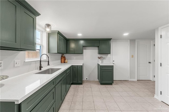 2904 N 26th St, Mcallen, TX 78501 - kitchen with green cabinets, a sink, light countertops, recessed lighting, and light tile patterned flooring
