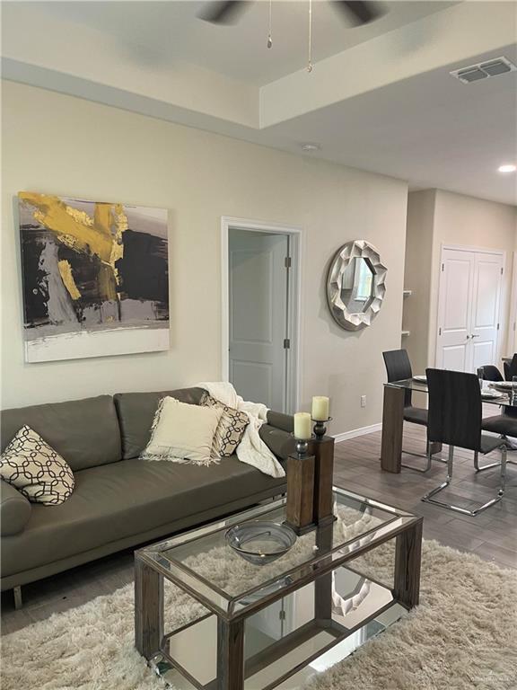 4905 N Hiawatha Dr, Pharr, TX 78577 - living area with a ceiling fan, baseboards, and wood finished floors