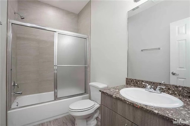 4905 N Hiawatha Dr, Pharr, TX 78577 - full bathroom with vanity, toilet, and enclosed tub / shower combo