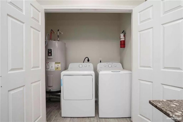 4905 N Hiawatha Dr, Pharr, TX 78577 - laundry area with water heater, separate washer and dryer, and light wood-type flooring