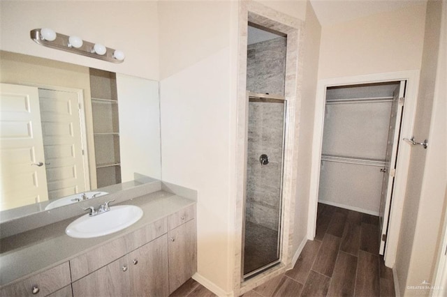 4905 N Hiawatha Dr, Pharr, TX 78577 - full bath with wood finished floors, a shower stall, and vanity
