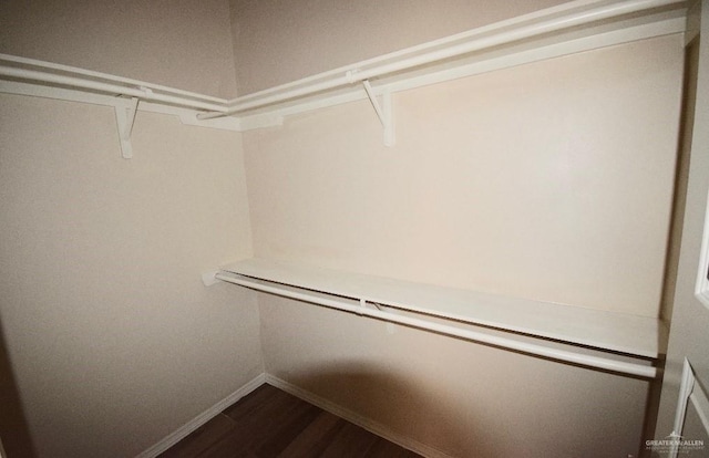 4905 N Hiawatha Dr, Pharr, TX 78577 - walk in closet featuring dark wood-style floors