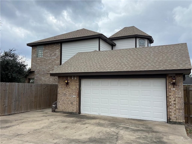 view of front of property with a garage