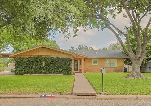 ranch-style home with central AC and a front lawn